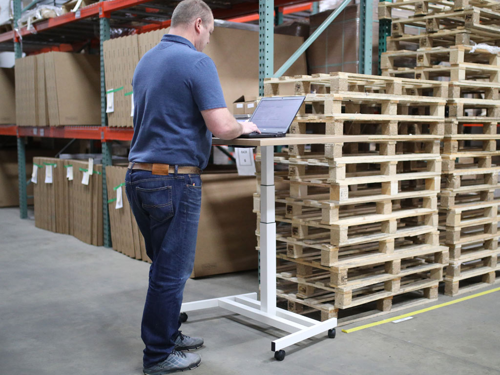 man using warehouse qr code management system app 1024x768px.jpg